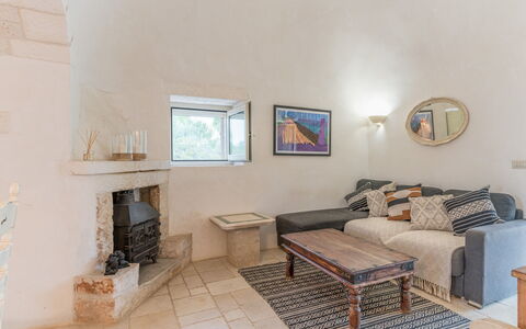 Trullo Ulivo: Picture Frame, Property, Building, Table, Wood, Couch, Living Room, Interior Design, Flooring, Comfort