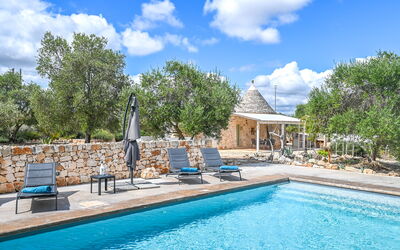 Trullo Ulivo: Water, Cloud, Plant, Sky, Property, Furniture, Swimming Pool, Blue, Azure, Tree