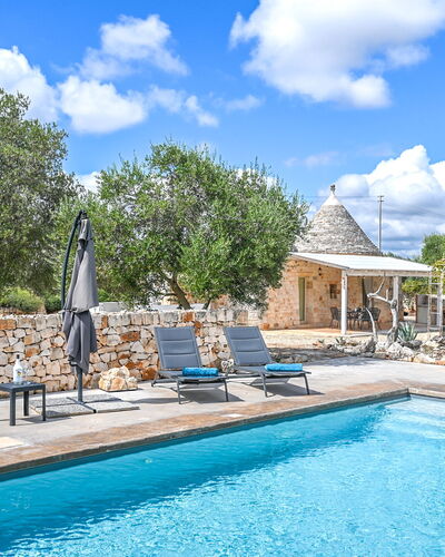 Trullo Ulivo: Water, Cloud, Plant, Sky, Property, Furniture, Swimming Pool, Blue, Azure, Tree