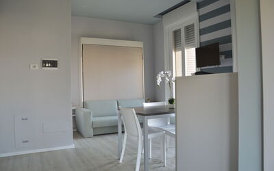 Pavia Tower 1: Building, Chair, Flooring, Wood, Couch, Floor, Living Room, Door