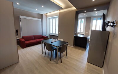 Pavia Tower 3: Couch, Property, Table, Furniture, Comfort, Building, Wood, Television, Interior Design, Living Room