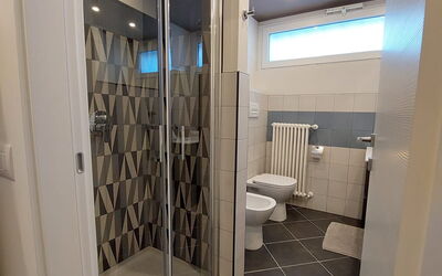 Pavia Tower 9: Plumbing Fixture, Interior Design, Bathroom, Shower Door, Floor, Flooring, Composite Material, Ceiling