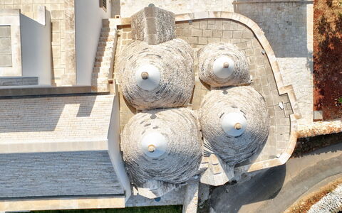 Trullo Under The Apulian Sky: Wood, Sculpture, Water, Art, Automotive Tire, Font, Concrete, Metal