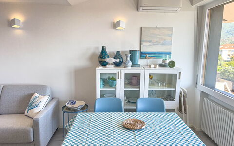 Appartamento La Castellana: Table, Furniture, Property, Azure, Couch, Wood, Comfort, Interior Design, Floor, Flooring