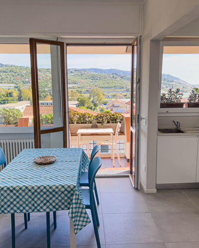 Appartamento La Castellana: Furniture, Property, Chair, Table, Cabinetry, Azure, Countertop, Interior Design, Shade, Wood
