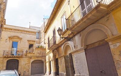 Corte Tiso: Property, Window, Sky, Door, Vehicle, Neighbourhood, Car, Cloud, Facade, City