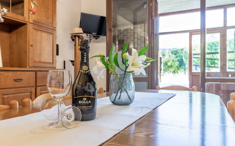 Casa Tramonti: Table, Furniture, Property, Plant, Cabinetry, Bottle, Building, Window, Wood, Countertop