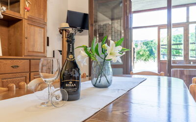 Casa Tramonti: Table, Furniture, Property, Plant, Cabinetry, Bottle, Building, Window, Wood, Countertop