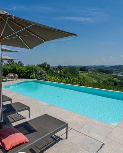 Relais Casa Clara - Roero - Langhe, Piemonte: Blue, Swimming Pool, Resort, Outdoor Furniture, Sunlounger, Eco Hotel, Landscaping, Shade, Chair, Umbrella