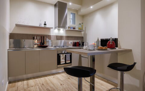 Betty Florence Charming Modern Apartment Near Piaz: Cabinetry, Furniture, Building, Countertop, Wood, Interior Design, Flooring, Floor, Table, Kitchen