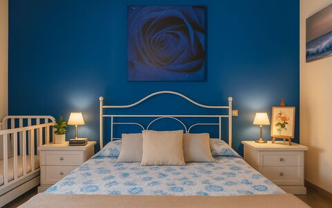 Rifugio a Tisiddu: Furniture, Blue, Bed, Interior Design, Bedroom, Wall, Wood, Bedding, Floor, Flooring