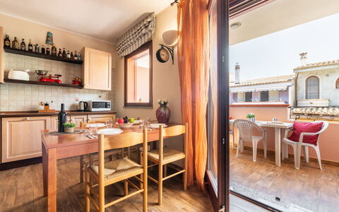 Rifugio a Tisiddu: Table, Furniture, Property, Wood, Lighting, Building, Cabinetry, Interior Design, Chair, Window