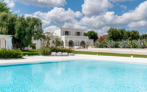 Masseria Isaia: Water, Cloud, Sky, Plant, Property, Building, Azure, Tree, Swimming Pool, Grass
