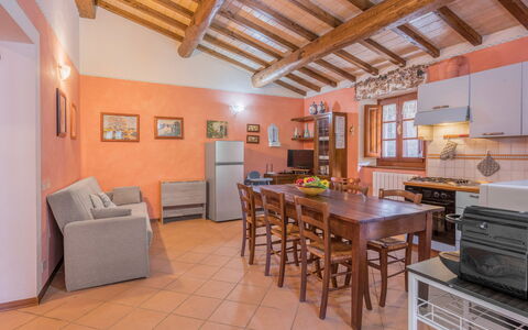 La Vecchia Fornace La Piastra Apartments - Abetone: Table, Cabinetry, Wood, Interior Design, Floor, Picture Frame, Flooring, Kitchen, Living Room, Countertop