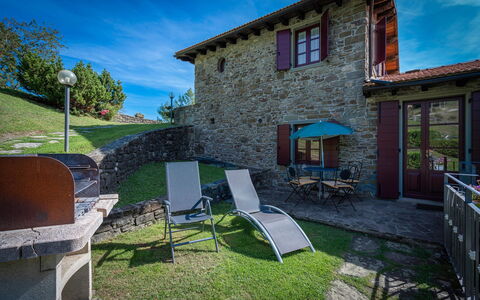 La Vecchia Fornace La Piastra Apartments - Abetone: Sky, Property, Building, Plant, Cloud, Window, Azure, Shade, Chair, Outdoor Furniture