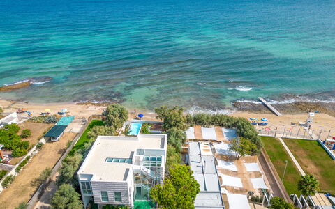 Villa Clementina: Water, Property, Plant, Sky, Azure, Building, Tree, Beach, Coastal And Oceanic Landforms, Urban Design