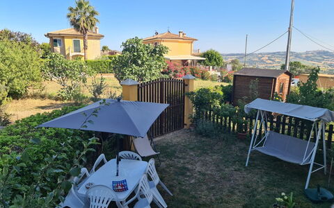 Il Colle Sul Mare Holiday Home: Sky, Plant, Property, Building, Tree, Shade, Outdoor Furniture, Biome, Urban Design, Grass