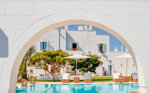 Masseria Lamacerase: Azure, Water, Building, Plant, Urban Design, Shade, Outdoor Furniture, Paint, Art, Tree