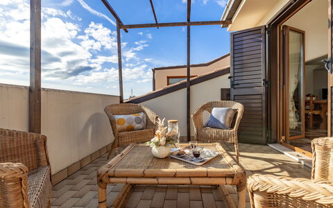 Altomare Apartment: Table, Furniture, Property, Building, Window, Cloud, Sky, Azure, Wood, Chair
