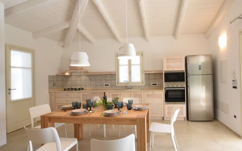 Villa Helios - Budoni, Sardegna: Property, Furniture, Table, Cabinetry, Chair, Wood, Lighting, Interior Design, Kitchen, Window