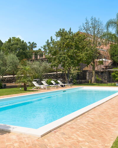 Oasi Verde - Santa Maria La Stella, Sicilia: Water, Sky, Plant, Property, Swimming Pool, Nature, Azure, Shade, Grass, Tree