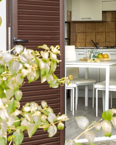 Golfo Aranci 150: Flower, Plant, Table, Wood, Yellow, Building, Chair, Petal, House, Tap