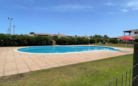 Luisa Apartment In Budoni, Shared Pool: Water, Sky, Plant, Swimming Pool, Cloud, Building, Shade, Rectangle, Grass, Tree