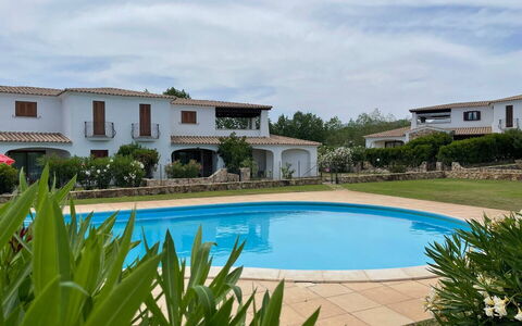 Luisa Apartment In Budoni, Shared Pool: Water, Cloud, Plant, Sky, Property, Building, Swimming Pool, Azure, Window, Body Of Water