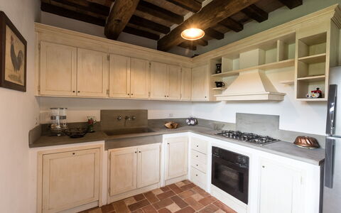 Villa Niccione: Cabinetry, Countertop, Property, Kitchen Stove, Kitchen Appliance, Kitchen, Wood, Cooktop, Interior Design, Home Appliance