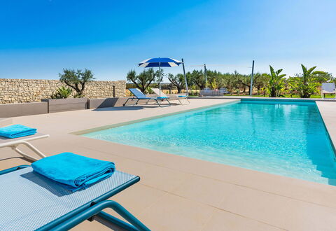 Casa Colori - Noto, Sicilia: Water, Sky, Property, Blue, Swimming Pool, Plant, Azure, Outdoor Furniture, Tree, Sunlounger