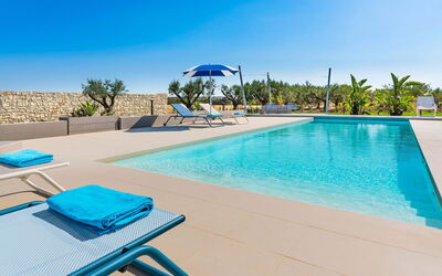 Casa Colori - Noto, Sicilia: Water, Sky, Property, Blue, Swimming Pool, Plant, Azure, Outdoor Furniture, Tree, Sunlounger
