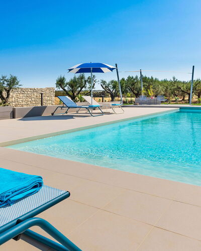 Casa Colori - Noto, Sicilia: Water, Sky, Property, Blue, Swimming Pool, Plant, Azure, Outdoor Furniture, Tree, Sunlounger