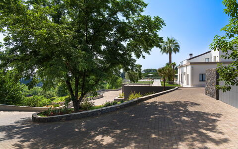 Villa Decoro - Mascali, Sicilia: Plant, Sky, Building, Road Surface, Tree, Shade, Asphalt, Land Lot, Window, Urban Design