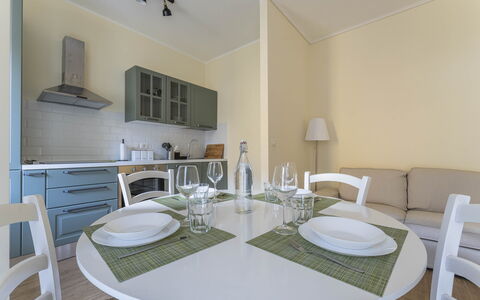 Spacious Apartment In Sori With Large Terrace - So: Table, Furniture, Property, Tableware, Chair, Countertop, Cabinetry, Wood, Lighting, Dishware