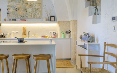 Lamia del Grano: Table, Furniture, Azure, Wood, Interior Design, Shelving, Kitchen, Desk, Countertop, Chair