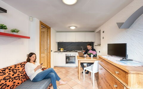 Incanto Walser Apartments Testa: Furniture, Interior Design, Table, Room, Ceiling, Countertop, Apartment, Chair, Cabinetry, Desk