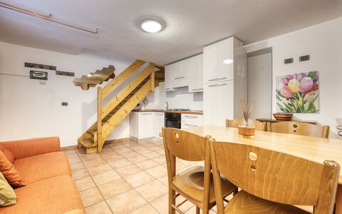 Incanto Walser Apartments Ronco: Furniture, Table, Wood, Chair, Flooring, Floor, Plant, Living Room, Hardwood, Real Estate