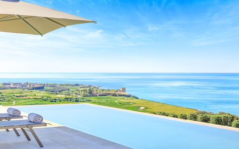 Villa Smeraldo - Sea Front | By Rocco Forte Villas: Sky, Water, Cloud, Building, Blue, Azure, House, Outdoor Furniture, Plant, Umbrella