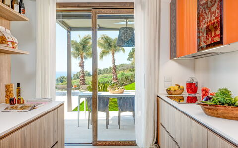 Villa Smeraldo - Sea Front | By Rocco Forte Villas: Property, Plant, Countertop, Cabinetry, Azure, Building, Table, Lighting, Orange, Interior Design