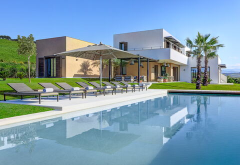 Villa Corallo - Sea Front | By Rocco Forte Villas: Water, Sky, Building, Azure, Plant, Shade, Swimming Pool, Tree, Urban Design, Residential Area