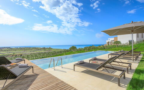 Villa Topazio - Sea View | By Rocco Forte Villas: Cloud, Sky, Water, Building, Seaside Resort, Azure, Plant, Outdoor Furniture, Shade, Condominium