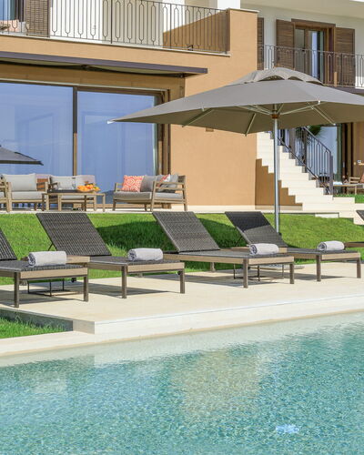 Villa Topazio - Sea View | By Rocco Forte Villas: Water, Window, Plant, Building, Shade, Swimming Pool, Outdoor Furniture, Sunlounger, Urban Design, Condominium