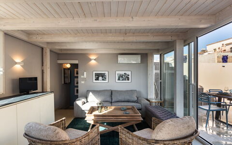 Terrazza Di Erika: Table, Couch, Furniture, Property, Comfort, Wood, Lighting, Picture Frame, Interior Design, Studio Couch