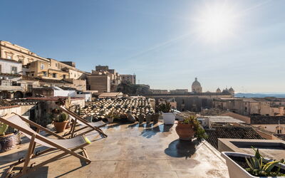 Terrazza Di Erika: Sky, Building, Urban Design, Plant, Flowerpot, Residential Area, House, Landscape, Cloud, Houseplant