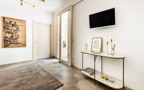 Alma Suite: Furniture, Property, Picture Frame, Building, Wood, Television, Interior Design, Lighting, House, Living Room