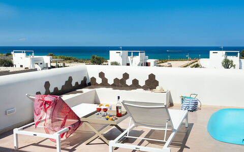 Villa Pachino: Sky, Furniture, Water, Building, Table, Chair, Outdoor Furniture, Shade, Seaside Resort, Leisure