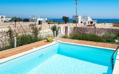 Villa Pachino: Water, Sky, Building, Property, Plant, Blue, Swimming Pool, Light, Azure, Rectangle