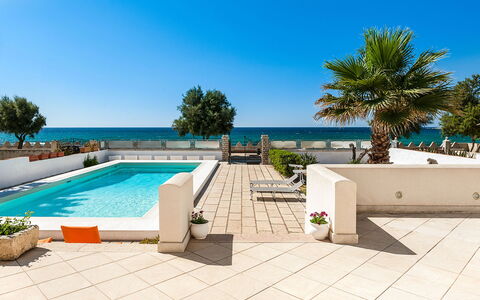 Villa Cornino: Water, Sky, Property, Plant, Tree, Building, Shade, Outdoor Furniture, Swimming Pool, Residential Area