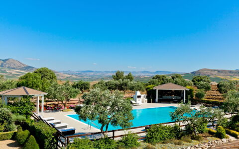 Villa Castellammare: Sky, Plant, Azure, Tree, Natural Landscape, Mountain, Water, Building, Land Lot, Arecales
