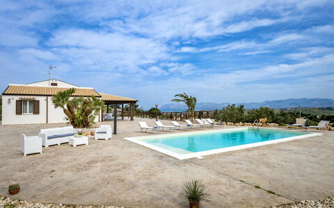 Villa Alcamo: Cloud, Water, Sky, Plant, Swimming Pool, Building, Azure, Tree, Shade, Arecales
